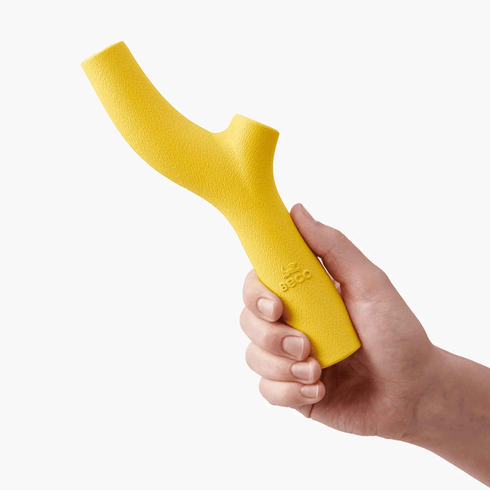 Beco Super Stick natural rubber dog toy in yellow, showing the hollow fillable end