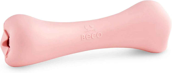 Beco Treat Bone natural rubber dog chew toy in pink, shown from the side