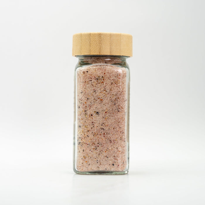 Unlabeled glass jar with wooden lid.