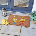 Rectangular coir doormat printed with a row of ducks wearing wellington boots, shown flat from above