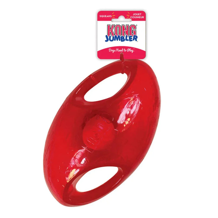 KONG Jumbler Football in red translucent rubber, an oval shell with two moulded handle openings and a ball visible inside