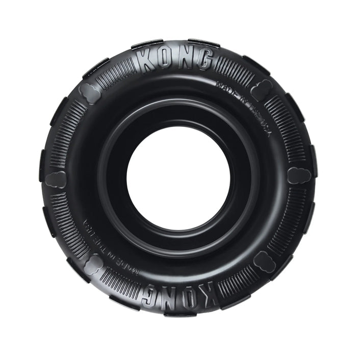 KONG Traxx tyre-shaped natural rubber dog toy with a hollow inner channel for treats
