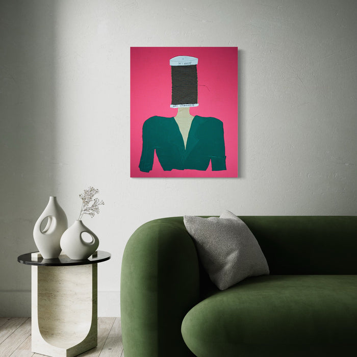 The artwork 'Picking Up The Threads Of Time' by Ali Ha features a surreal collage composition with a large black thread spool replacing a figure's head atop an emerald green blazer, set against a vibrant pink background. The mixed-media piece combines fabric applique with acrylic paint details, creating a striking contemporary statement piece.