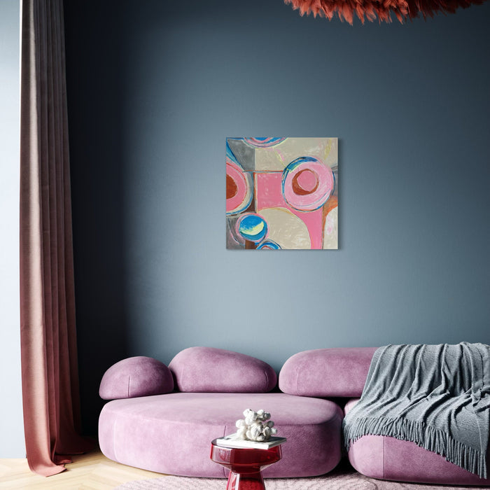 The artwork 'Pop Stand' by Beth Barry features vibrant circular patterns in pink, blue, and beige tones on a square canvas. Abstract concentric circles create a playful, retro-inspired composition against a neutral background. The modern acrylic painting showcases bold geometric forms and soft color transitions, measuring 36x36 inches. By Beth Barry.