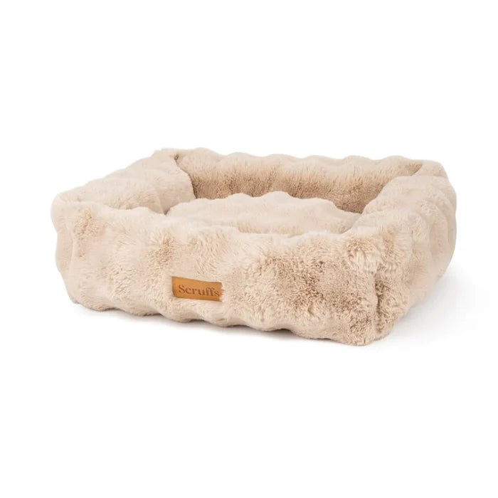 Scruffs Alpine box bed in champagne faux fur, deep bolster walls running right round the bed