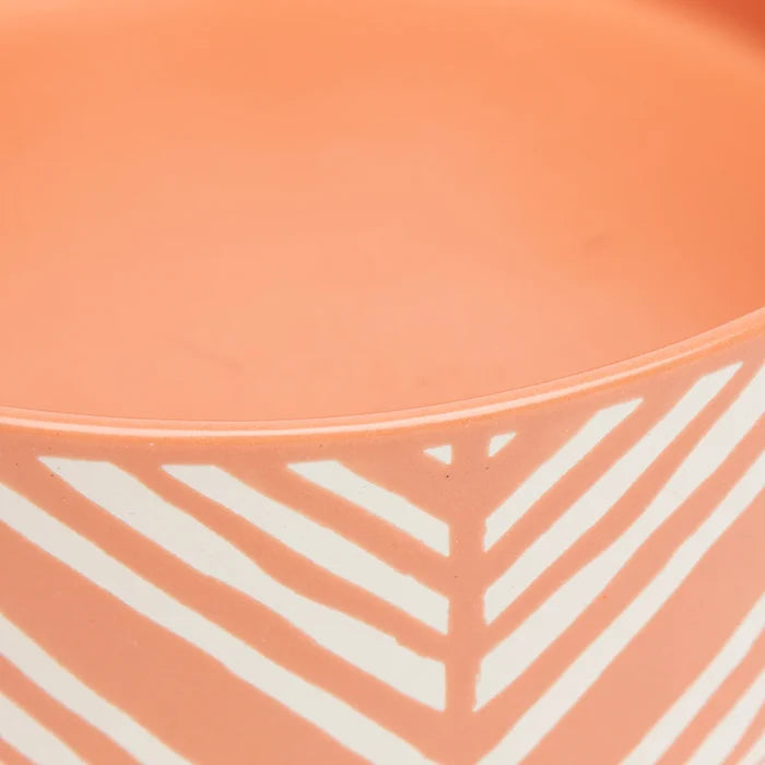 Close detail of the wax resist Aztec pattern on terracotta glaze