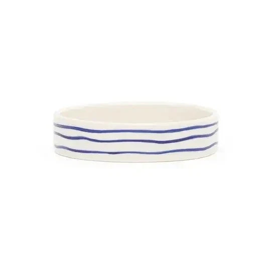 Scruffs Coastal cat saucer in blue ripple, a shallow 13cm dish that keeps whiskers off the sides