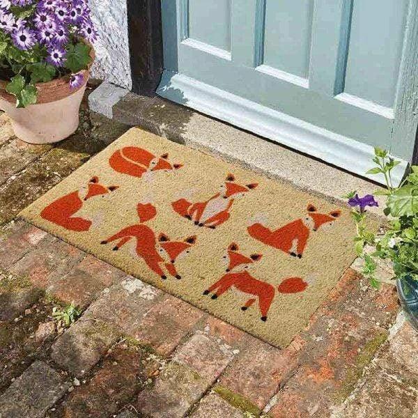 Smart Garden Six Vixens coir doormat printed with six red and white foxes in different poses, 45 by 75cm