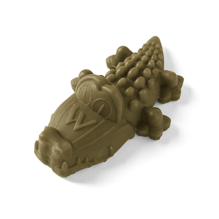 Whimzees Alligator dental dog chew, a ridged alligator-shaped plant-based chew shown from the side