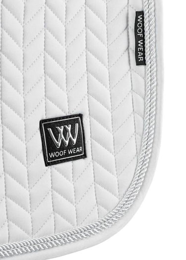 Woof Wear Herringbone dressage pad in white, further view showing the rope trim and silver badge